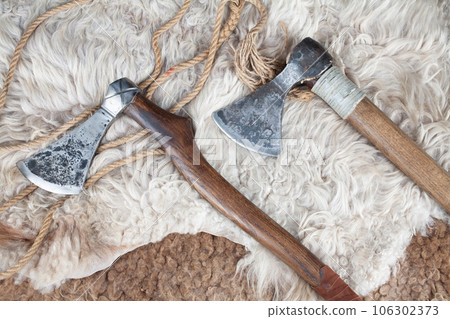 Viking battle axes on sheep fur 106302373