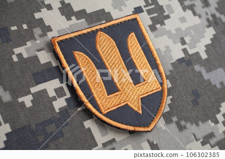 KYIV, UKRAINE - October 5, 2022. Russian invasion in Ukraine 2022. Ukraine Army uniform shoulder sleeve insignia badge. KYIV, UKRAINE - October 5, 2022. Russian invasion in Ukraine 2022. Ukraine Army uniform shoulder sleeve insignia badge. 106302385