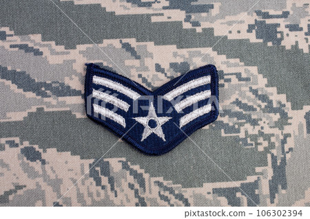 August 31, 2020. US AIR FORCE Senior Airman rank patch on digital tiger-stripe pattern Airman Battle Uniform August 31, 2020. US AIR FORCE Senior Airman rank patch on digital tiger-stripe pattern Airman Battle Uniform 106302394