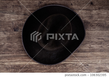 Old west hat on table. Top view. Old west hat on table. Top view. 106302395