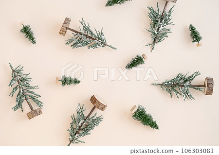 Winter holidays arrangement. Toy fir trees layout. 106303081