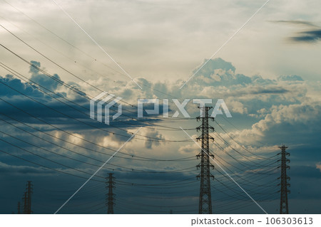 Transmission tower and cumulonimbus clouds in the summer evening sky a-5 film style Transmission tower and cumulonimbus clouds in the summer evening sky a-5 film style 106303613