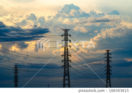 Transmission tower and cumulonimbus clouds in the summer evening sky b-2 High saturation contrast Transmission tower and cumulonimbus clouds in the summer evening sky b-2 High saturation contrast 106303615