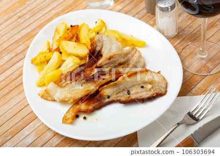 Fried pork with potatoes 106303694