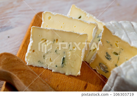 Creamy blue cheese on wooden board 106303719