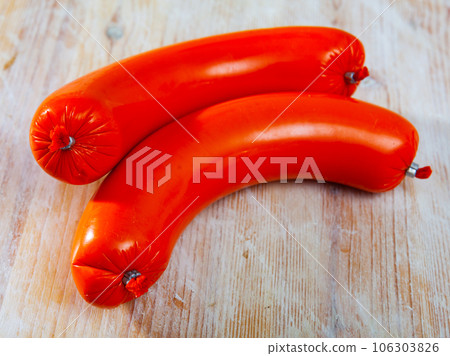 Close-up of mortadella sausage at wooden background 106303826