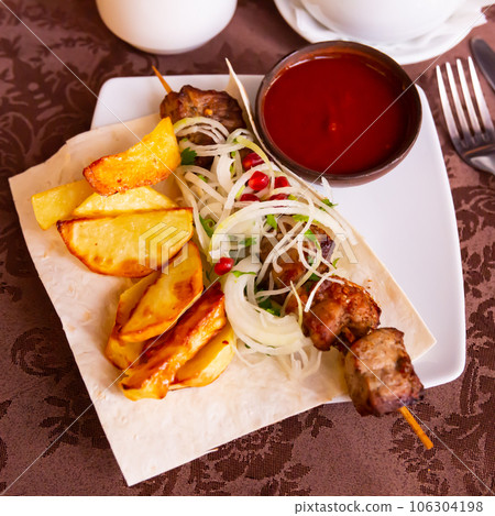 Appetizing pork shish kebab of Georgian cuisine 106304198