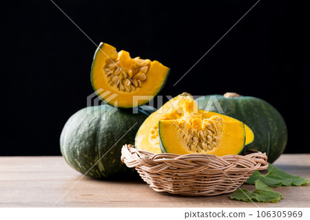 Green pumpkin on wooden with black background, Organic vegetable in autumn season 106305969
