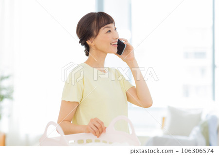 Woman Laundry Mobile phone Living room 106306574
