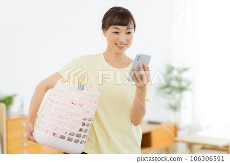 Woman Laundry Mobile phone Living room Woman Laundry Mobile phone Living room 106306591