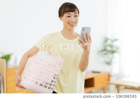 Woman Laundry Mobile phone Living room 106306593