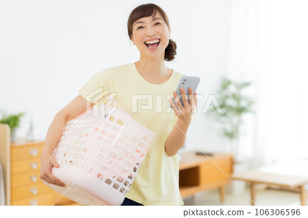 Woman Laundry Mobile phone Living room 106306596