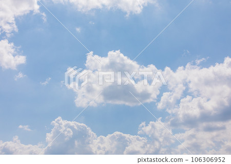 White puffy clouds over the blue sky on a sunny day. White puffy clouds over the blue sky on a sunny day. 106306952