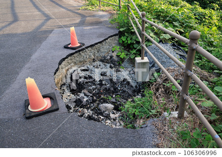 road damaged by natural disaster road damaged by natural disaster 106306996