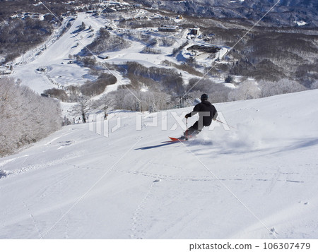 Madarao Kogen Ski Resort in winter Skiers skiing on the uncompacted upper giant course 106307479