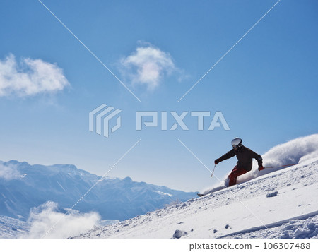 Madarao Kogen Ski Resort in winter Skiers skiing on the uncompacted upper giant course Madarao Kogen Ski Resort in winter Skiers skiing on the uncompacted upper giant course 106307488