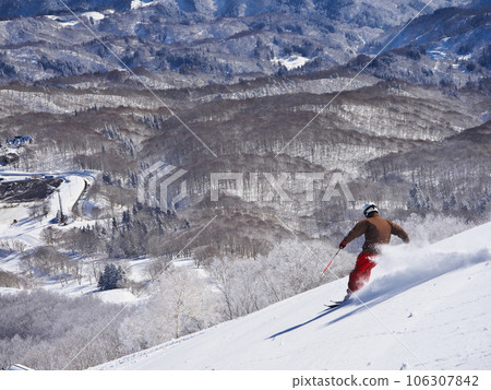 Madarao Kogen Ski Resort in winter Skiers skiing on the uncompacted upper giant course Madarao Kogen Ski Resort in winter Skiers skiing on the uncompacted upper giant course 106307842