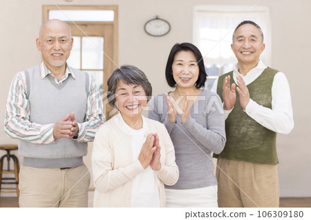 Senior men and women applauding side by side Senior men and women applauding side by side 106309180