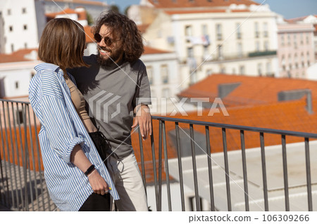 Couple in love hugging while standing on old city view with ancient architecture background Couple in love hugging while standing on old city view with ancient architecture background 106309266
