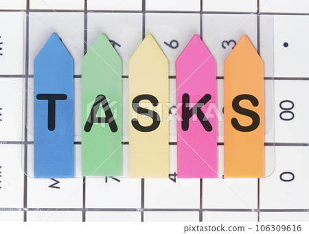 TASKS word is laid out of stickers with up arrows on the calculator 106309616