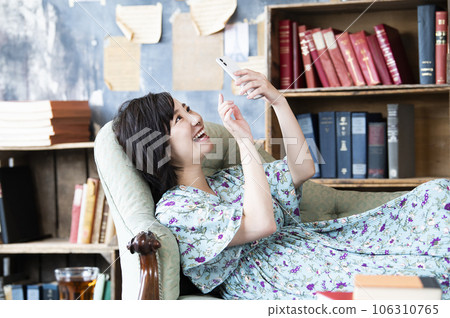 Young woman smartphone search smile image 106310765