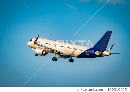 Passengers Commercial airplane flying above dramatic clouds. Travel concept. 106310925