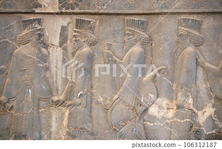 Ancient wall with bas-relief with assyrian foreign ambassadors with gifts and donations, Persepolis, Iran 106312187