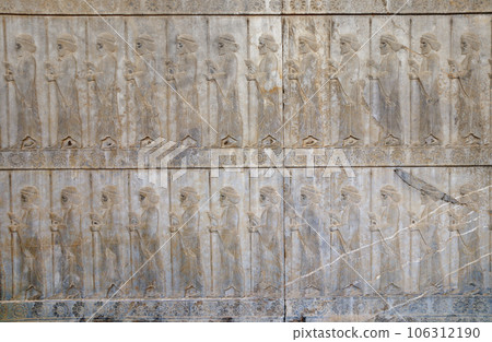Ancient wall with bas-relief with assyrian warriors with spears, Persepolis, Iran. UNESCO world heritage site Ancient wall with bas-relief with assyrian warriors with spears, Persepolis, Iran. UNESCO world heritage site 106312190