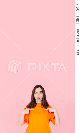 Surprised and Confident: Young Woman Expressing Astonishment and Self-Assurance, Pointing Two Surprised and Confident: Young Woman Expressing Astonishment and Self-Assurance, Pointing Two 106313549
