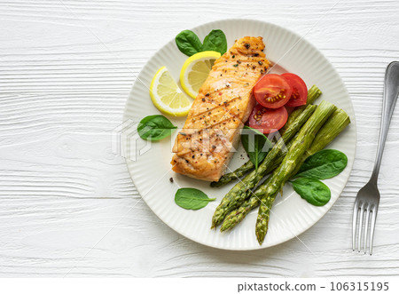 Baked Delicious salmon, green asparagus on plate Baked Delicious salmon, green asparagus on plate 106315195