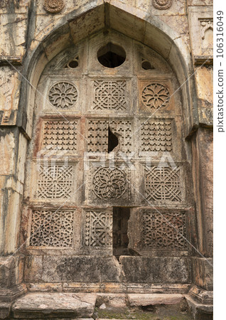 Carving details on the outer wall of Jali Mahal, located in Mandu, Madhya Pradesh, India Carving details on the outer wall of Jali Mahal, located in Mandu, Madhya Pradesh, India 106316049