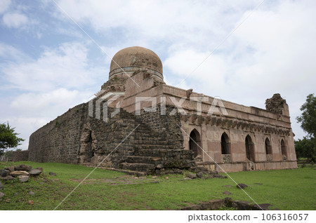 Dai Ki Chhoti Bahan Ka Mahal, a tomb of a lady, octagonal on plan, crowned by a shapely dome built in Red chisseled masonry with four arched openings facing the four cardinal points, located in Mandu, Dai Ki Chhoti Bahan Ka Mahal, a tomb of a lady, octagonal on plan, crowned by a shapely dome built in Red chisseled masonry with four arched openings facing the four cardinal points, located in Mandu, 106316057