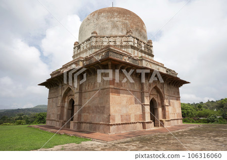 Dai Ka Mahal, a tomb of a lady, standing on a lofty basement having rooms with arched openings for the keepers of the tomb located in Mandu, Madhya Pradesh, India 106316060