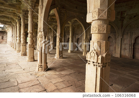 Carved pillars inside the Malik Mughith's Mosque, built A.D. 1452, belongs to the first phase of Mulsim architecture in Malwa, Mandu, Madhya Pradesh, India Carved pillars inside the Malik Mughith's Mosque, built A.D. 1452, belongs to the first phase of Mulsim architecture in Malwa, Mandu, Madhya Pradesh, India 106316068