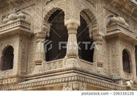 Carving details on the outer wall of Shri Ahilyeshwar Mandir, situated in Ahilya Devi Fort complex on the banks of River Narmada, Maheshwar, Madhya Pradesh, India Carving details on the outer wall of Shri Ahilyeshwar Mandir, situated in Ahilya Devi Fort complex on the banks of River Narmada, Maheshwar, Madhya Pradesh, India 106316120