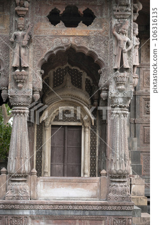 Carving details on the outer wall of the Krishnapura Chhatris, also known as the Krishna Pura Chhatris, built in the mid 19th century, Indore, Madhya Pradesh, India 106316135