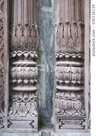 Carving details on the outer wall of the Krishnapura Chhatris, also known as the Krishna Pura Chhatris, built in the mid 19th century, Indore, Madhya Pradesh, India 106316139