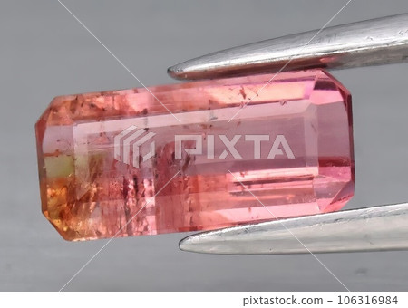 Natural gem pink tourmaline on gray background 106316984