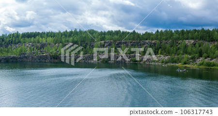 landscape with a clear lake on the site of an old stone quarry landscape with a clear lake on the site of an old stone quarry 106317743