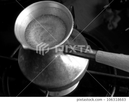Barista preparing hot tasty drink from copper turk Barista preparing hot tasty drink from copper turk 106318683