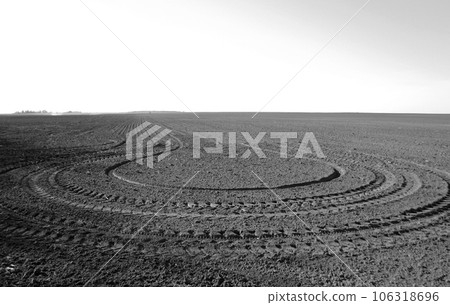 Plowed field for potato in black soil on open countryside nature Plowed field for potato in black soil on open countryside nature 106318696
