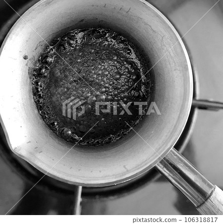 Barista preparing hot tasty drink from copper turk Barista preparing hot tasty drink from copper turk 106318817