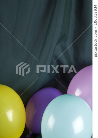 balloons in harmonious colors on a wavy green background balloons in harmonious colors on a wavy green background 106318934