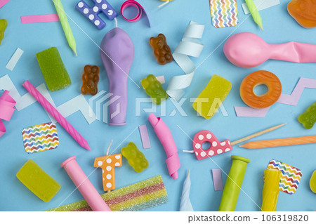 background of various jelly sweets, bears, donuts, candies, sprinkles, dragees close-up top view. background of various jelly sweets, bears, donuts, candies, sprinkles, dragees close-up top view. 106319820