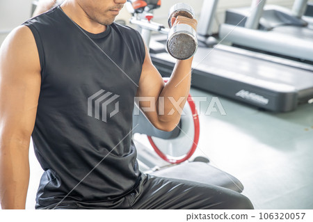 Men doing muscle training with dumbbells 106320057