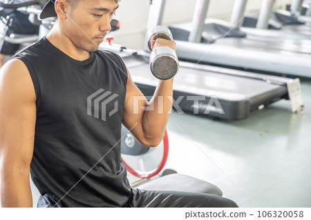 Men doing muscle training with dumbbells 106320058