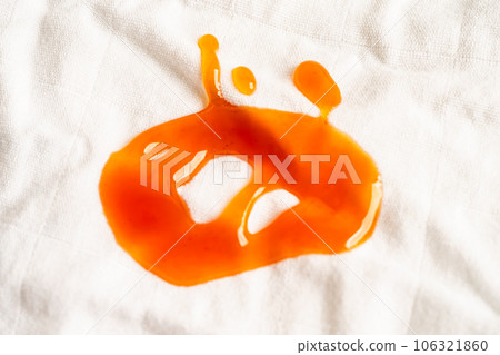Dirty tomato sauce stain or ketchup on cloth to wash with washing powder, cleaning housework concept. 106321860