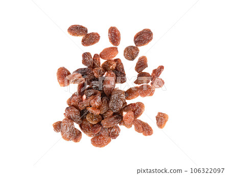 Top view of sweet dehydrated raisins on white background. Top view of sweet dehydrated raisins on white background. 106322097