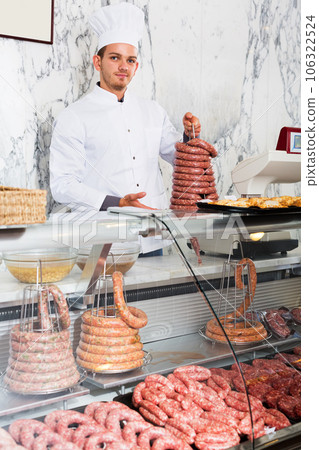 Young cook at butcher store Young cook at butcher store 106322524