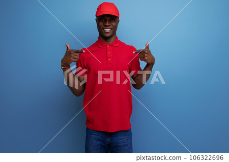 successful young american man dressed in corporate attire consisting of a baseball cap and t-shirt 106322696